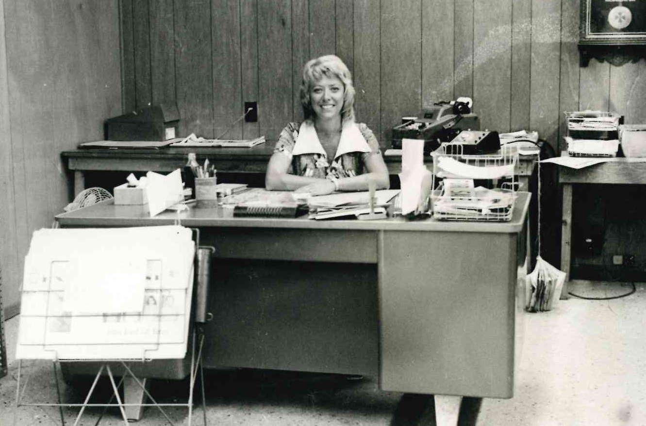 Vicki Oliver at her desk, circa 1963